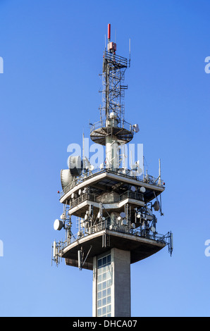 Various antennas on the TV tower on blue sky Stock Photo