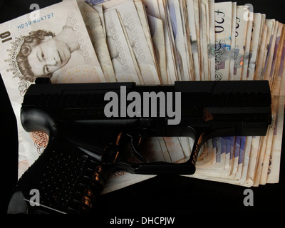 Gun and Money, UK Stock Photo