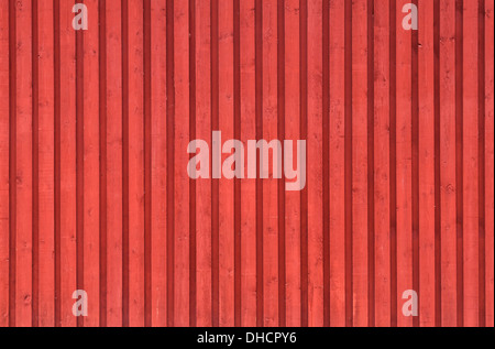 Ordinary Scandinavian architecture fragment. Red rural wooden wall. Background photo texture Stock Photo