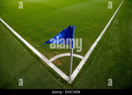 A view of a corner quadrant and blue flag on a football pitch. Stock Photo