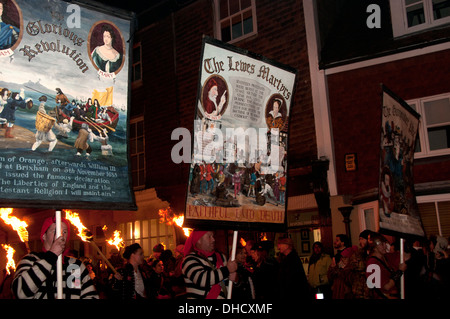 Lewes, Sussex. Bonfire Night November 5th 2013. Members of Cliffe Bonfire Society parade with banners Stock Photo