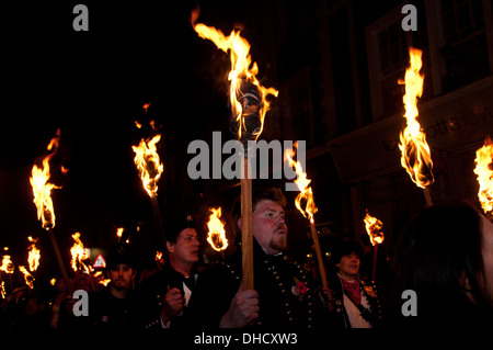 Lewes, Sussex. Bonfire Night November 5th 2013. Cliffe Bonfire Society members parade with burning brands. Stock Photo