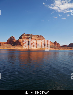 Red cliffs reflected in the smooth water Stock Photo