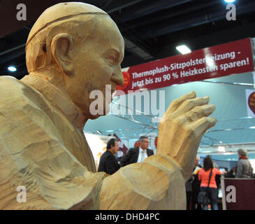 Augsburg, Germany. 07th Nov, 2013. A wooden statue of Pope Francis is seen at a booth at the church trade fair 'Gloria' in Augsburg, Germany, 07 November 2013. The fair which features products around the church runs until 09 November 2013. Photo: STEFAN PUCHNER/dpa/Alamy Live News Stock Photo