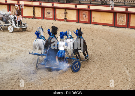 Roman Chariot Race re-enactment in the amphitheatre at Puy Du Fou France Stock Photo