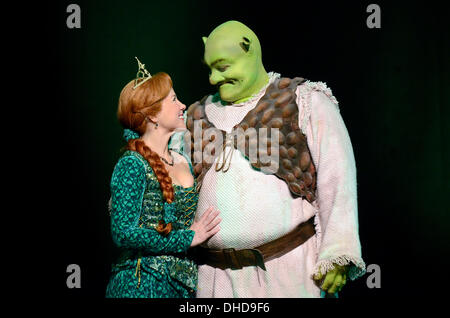 Duesseldorf, Germany. 07th Nov, 2013. The performer Frank Winkels dressed as Shrek and Jana Stelley as Fiona pose on the stage during the casting for the musical 'Shrek' in the Capitol Theatre in Duesseldorf, Germany, 07 November 2013. The hero Shrek and his princess Fiona fascinated an audience of millions in the cinemas worldwide. In October 2014 the musical celebrates its premiere in the Capitol Theatre in Duesseldorf. Photo: HORST OSSINGER/dpa/Alamy Live News Stock Photo