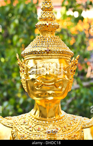Golden statue in Wat Phra Keao in the Grand Palace in Bangkok Thailand Stock Photo