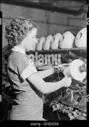 High Point, North Carolina - Textiles. Pickett Yarn Mill. Winder operator - highly skilled - showing hands in... 518520 Stock Photo