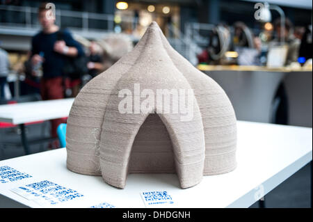 London, UK. 7th November 2013. a 3D printed house model made of clay by the WASProject is on display at the 3D Printshow at the Business Design Centre in London. WASP is a brand owned by Massimo Moretti’s CSP srl and is specialized in design, development and production of projects for saving the world with digital technologies, creating huge 3D printers able to print clay-houses and help solving the problem of bidonvilles in the 3rd world. Credit:  Piero Cruciatti/Ģ����ý Live News Stock Photo