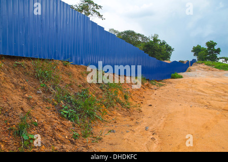 Blue fence to prevent unauthorised intrusion. Stock Photo