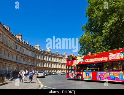 Bath tour bus driving around The Circus in Bath with its Georgian Architecture Bath City Somerset England UK GB EU Europe Stock Photo