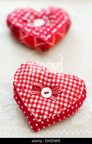 Red heart with ribbon bow on handmade Stock Photo