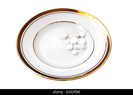 White pills on white china isolated on white background Stock Photo