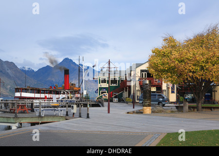 SS Earnslaw steamboat moored on Lake Wakatipu by waterfront steamer quay in Queenstown, Otago, South Island, New Zealand. Stock Photo