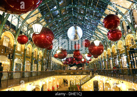 London, UK. 7th November 2013. Red Xmas baubles at the Covent Garden Market Christmas Decorations and Lights, London, England Credit:  Paul Brown/Alamy Live News Stock Photo