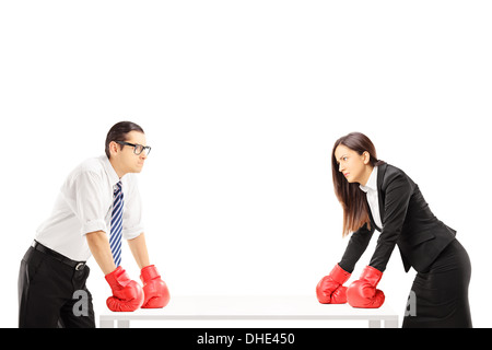 Two angry businesspeople with boxing gloves having an argument Stock Photo