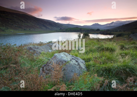 Llyn Mymbyr, Snowdonia, Wales, at sunset with Snowdon in the distance. Stock Photo