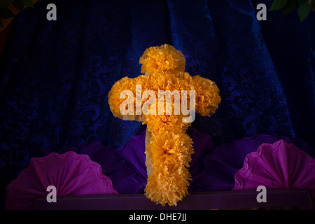 A cross made of marigold flowers decorate an altar during the Day of the Dead celebrations in Oaxaca, Mexico Stock Photo