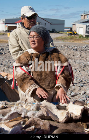 Canada, Nunavut, western shore of Hudson Bay, Kivalliq Region, Arviat. Inuit woman (Mary) in traditional caribou hide. Stock Photo