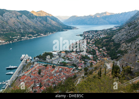 Kotor Old Town, marina and fortifications at dawn with view of the Bay of Kotor, UNESCO World Heritage Site, Montenegro, Europe Stock Photo