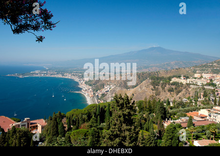 A view to Mount Etna and Naxos Bay on the Ionian Sea from the Greek Theatre in Taormina, Sicily, Italy, Mediterranean, Europe