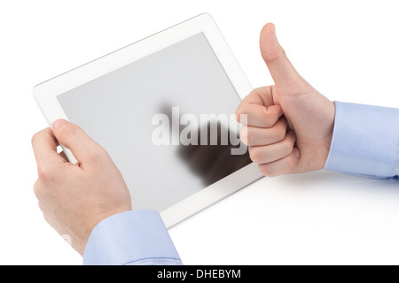 Man's hand holding a tablet computer and the other hand showing thumbs up gesture on a white background. Stock Photo