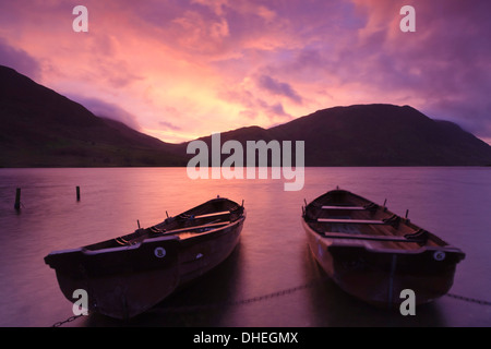 Rowing boats on Crummock Water at sunset, Lake District National Park, Cumbria, England, United Kingdom, Europe Stock Photo