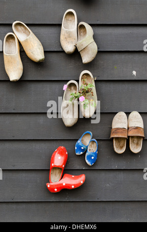traditional dutch wooden shoes hanging at a wall Stock Photo