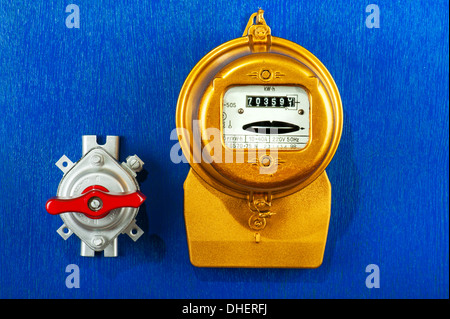 Golden retro electric meter with toggle switch Stock Photo