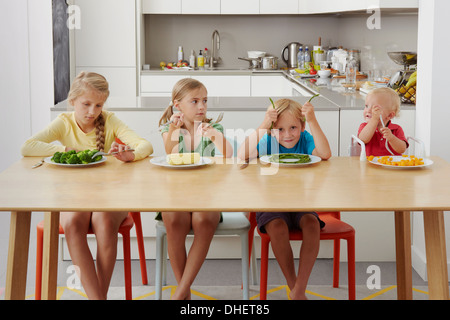 Children refusing to eat vegetables Stock Photo
