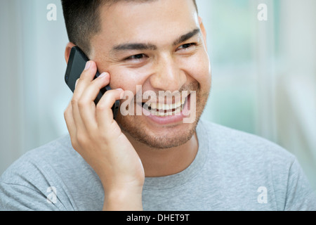 Mid adult man on telephone call Stock Photo