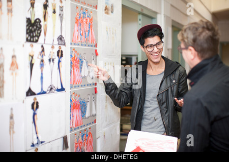 Fashion design teacher and student in discussion Stock Photo