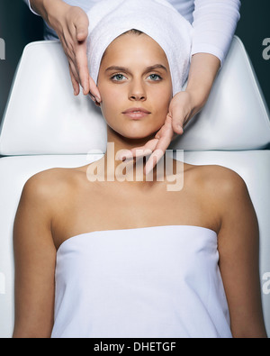 Young woman having facial treatment Stock Photo