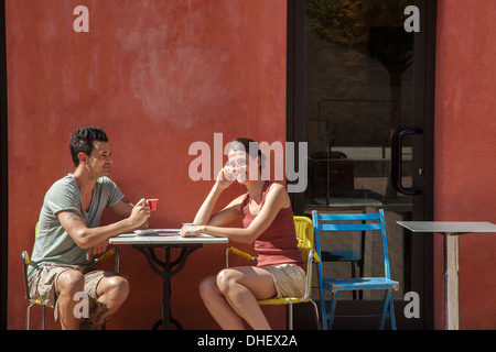 Couple sitting outside cafe, Florence, Tuscany, Italy Stock Photo