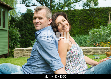 Portrait of mature couple back to back Stock Photo