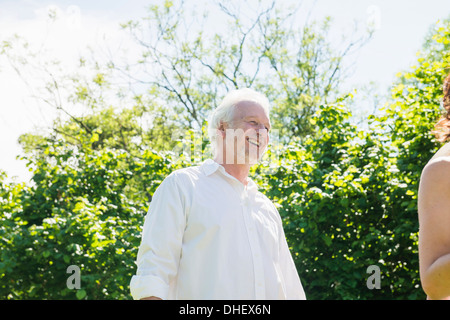 Senior man wearing white shirt, laughing Stock Photo