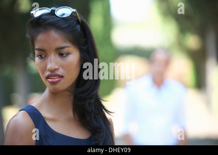 Woman looking down sideways Stock Photo