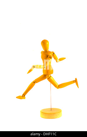 running wooden dummy mannequin for art isolated on white Stock Photo