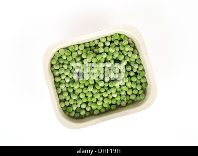 Tray of uncooked  Bird's Eye frozen peas on white background, cutout. USA. Stock Photo