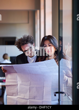 Two architects with blueprints Stock Photo