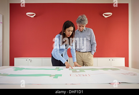 Two architects with blueprints Stock Photo