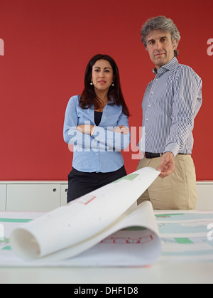 Two architects with blueprints Stock Photo