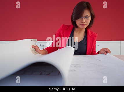 Female architect with blueprints Stock Photo