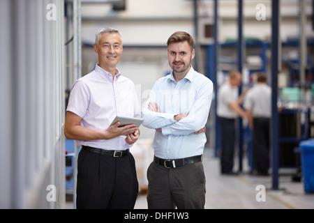 Portrait of two engineers in engineering factory Stock Photo