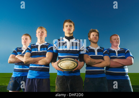 Portrait of rugby team, one man holding ball Stock Photo