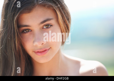 Portrait of brunette teenage girl looking at camera Stock Photo