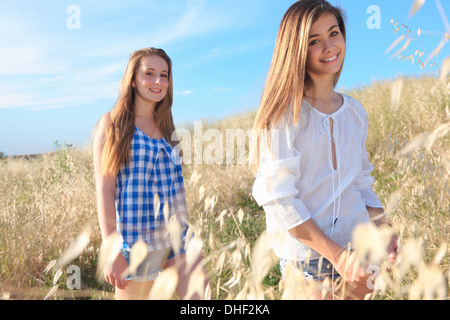 Teenage girls in field, Tuscany, Italy Stock Photo