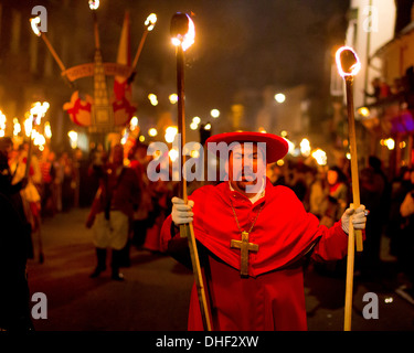 Man dressed as a Roman Catholic cardinal at the head of the Procession of the South Street Bonfire Society - Lewes bonfire night Stock Photo