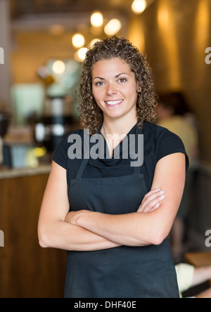 Waitress Standing Arms Crossed In Espresso Bar Stock Photo