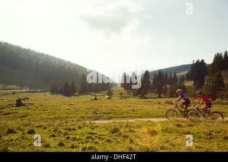 Man and woman mountain biking, Styria, Austria Stock Photo